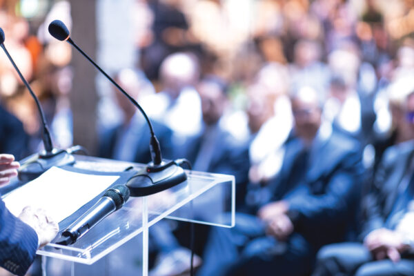 Executive microphones at a board presentation—symbolizing strategic financial storytelling and stakeholder engagement at the highest level
