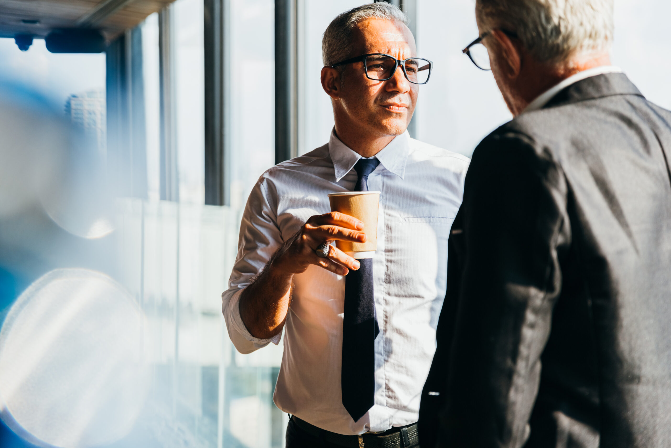 Executives discussing turnaround strategy—symbolizing crisis management, debt restructuring, and strategic recovery support