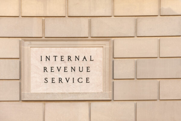 Engraved Internal Revenue Service sign on a stone wall, symbolizing The William Stanley CFO Group’s Keeper Tax feature discussing the Cohan Rule and IRS substantiation.